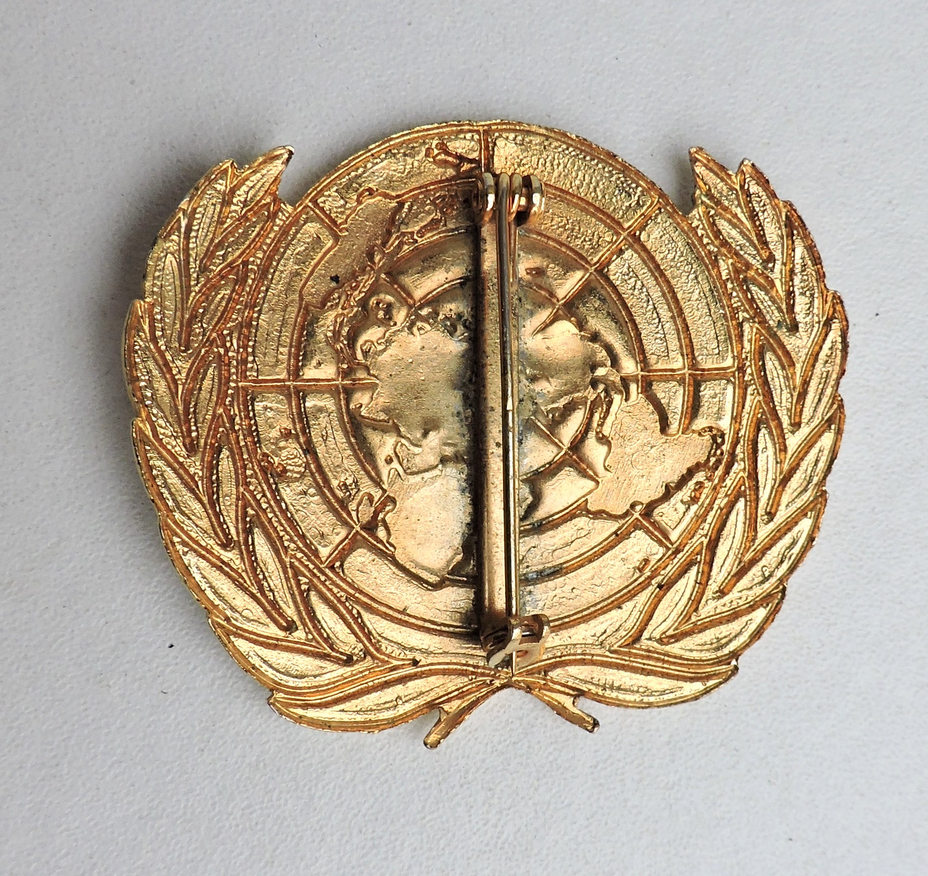 Enameled United Nations beret badge