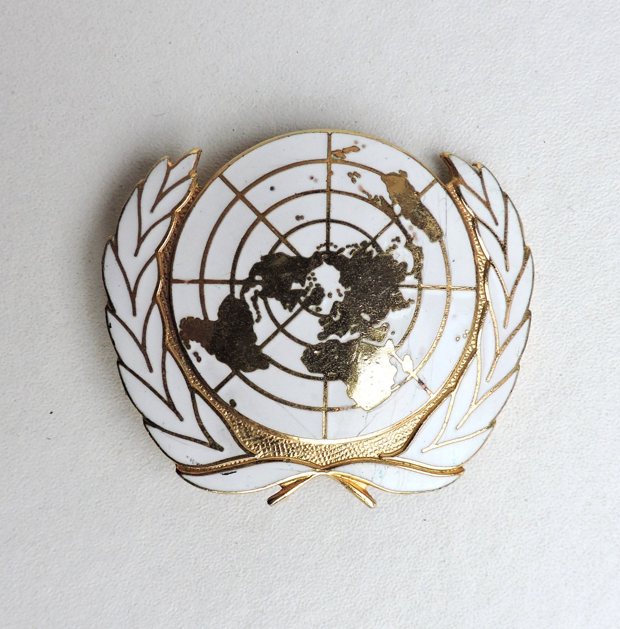 Enameled United Nations beret badge
